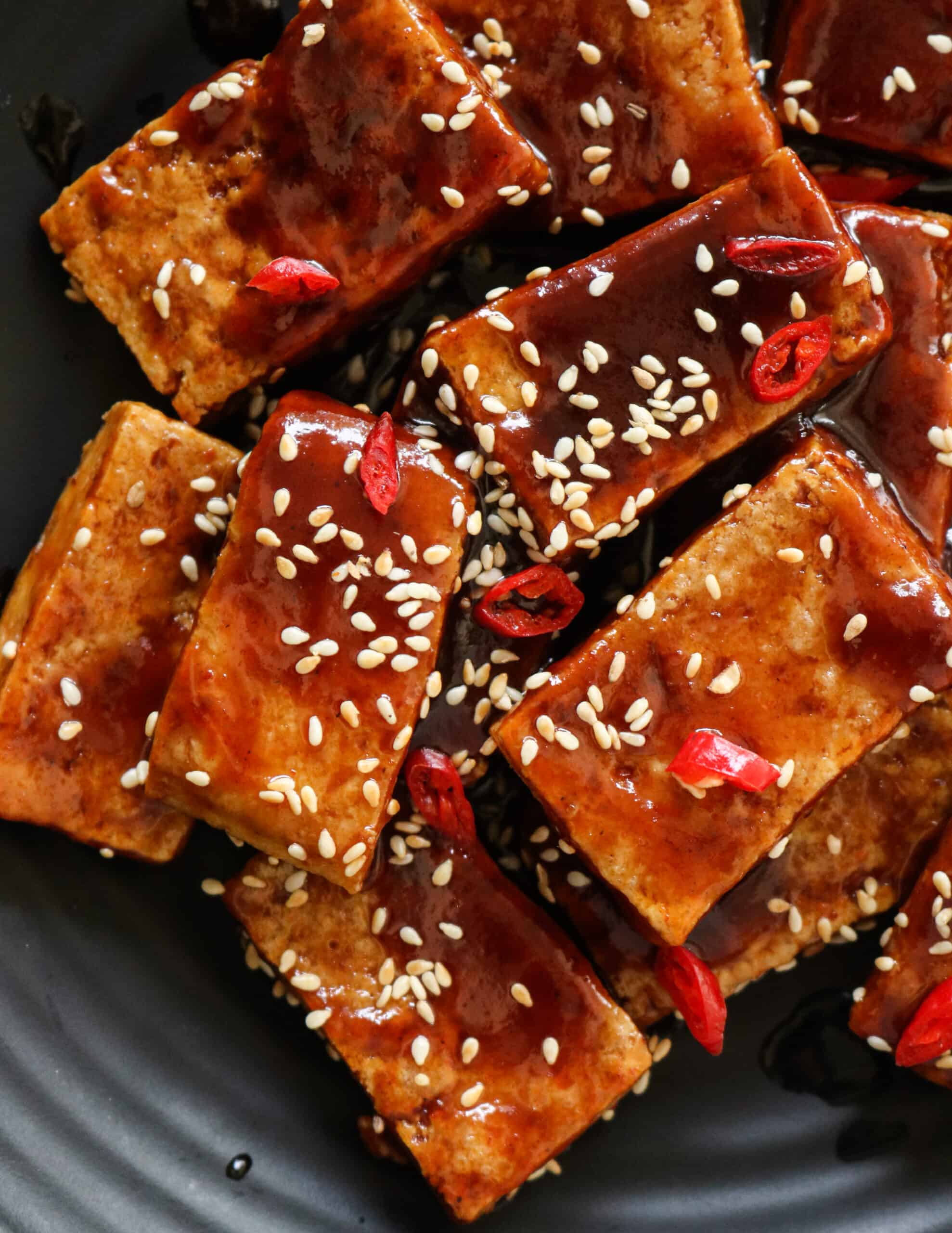 teriyaki tofu served sprinkled with sesame seeds.