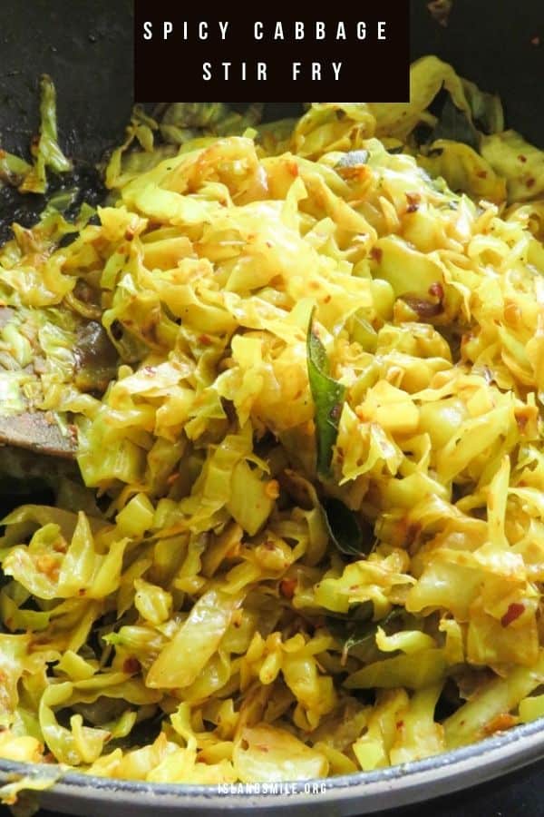 cabbage stir fried cooked in a pan with a wooden spoon