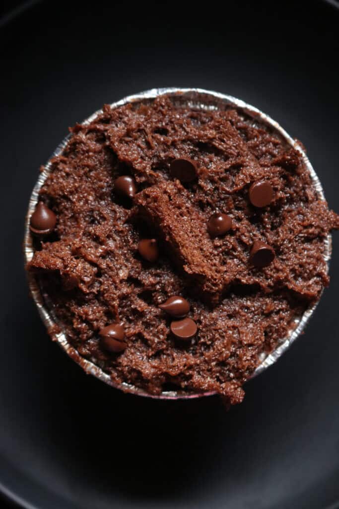 adding the chocolate bread into a mould to make chocolate bread pudding