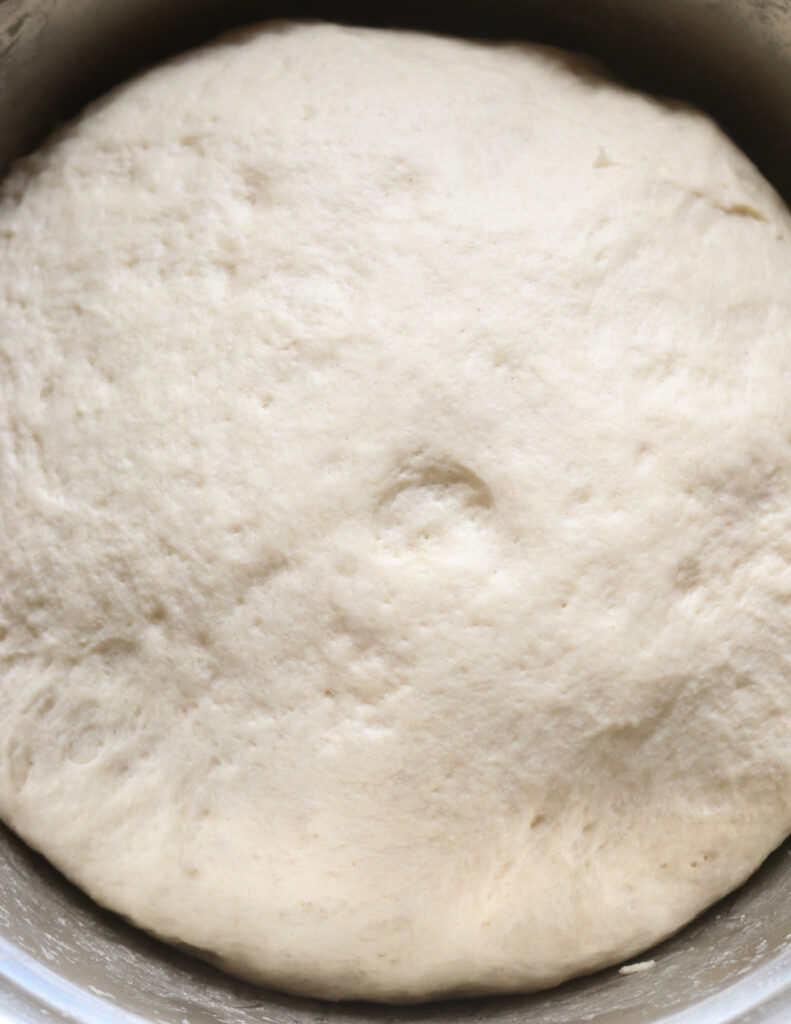 dough risen to make the kibula banis.