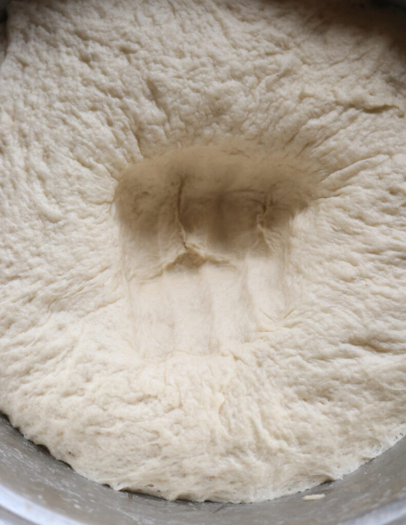 dough punched in to deflate.