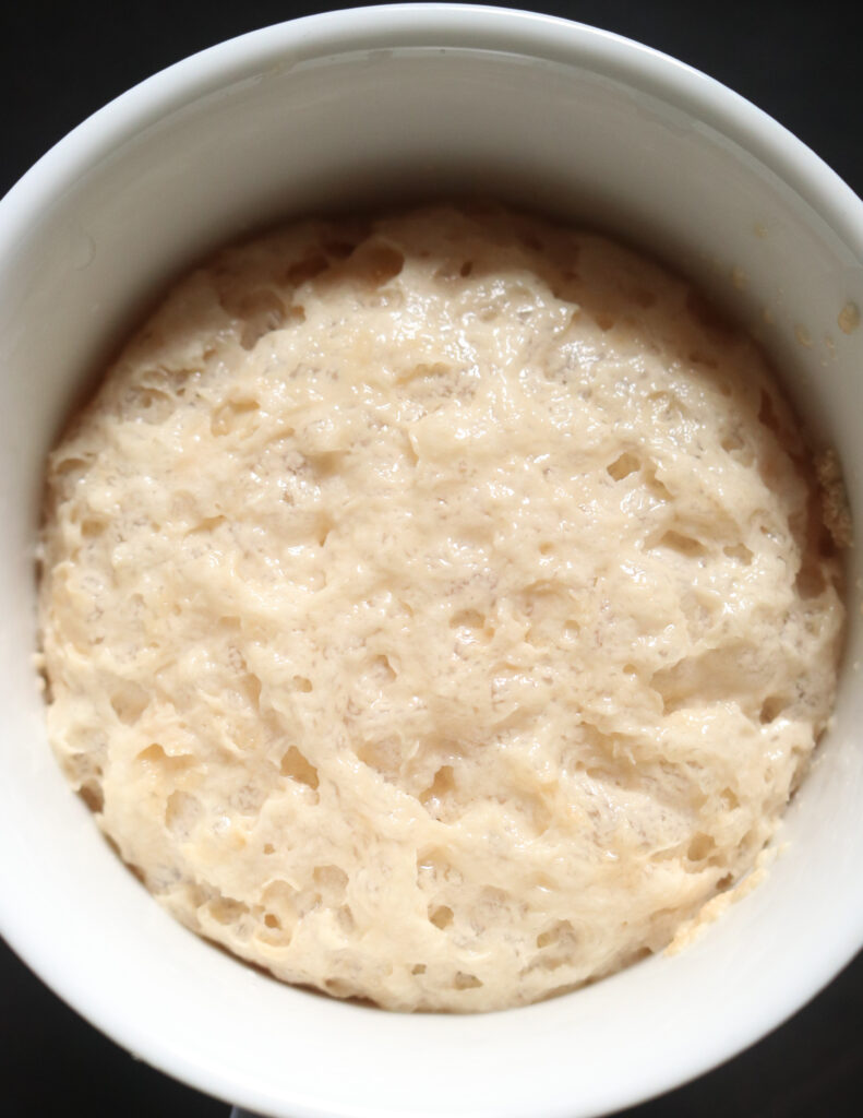 yeast activated in a white bowl.