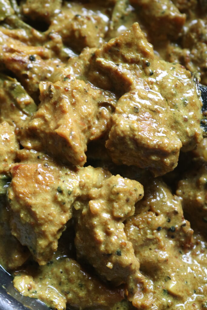 black pepper beef curry covered in thick coconut milk gravy