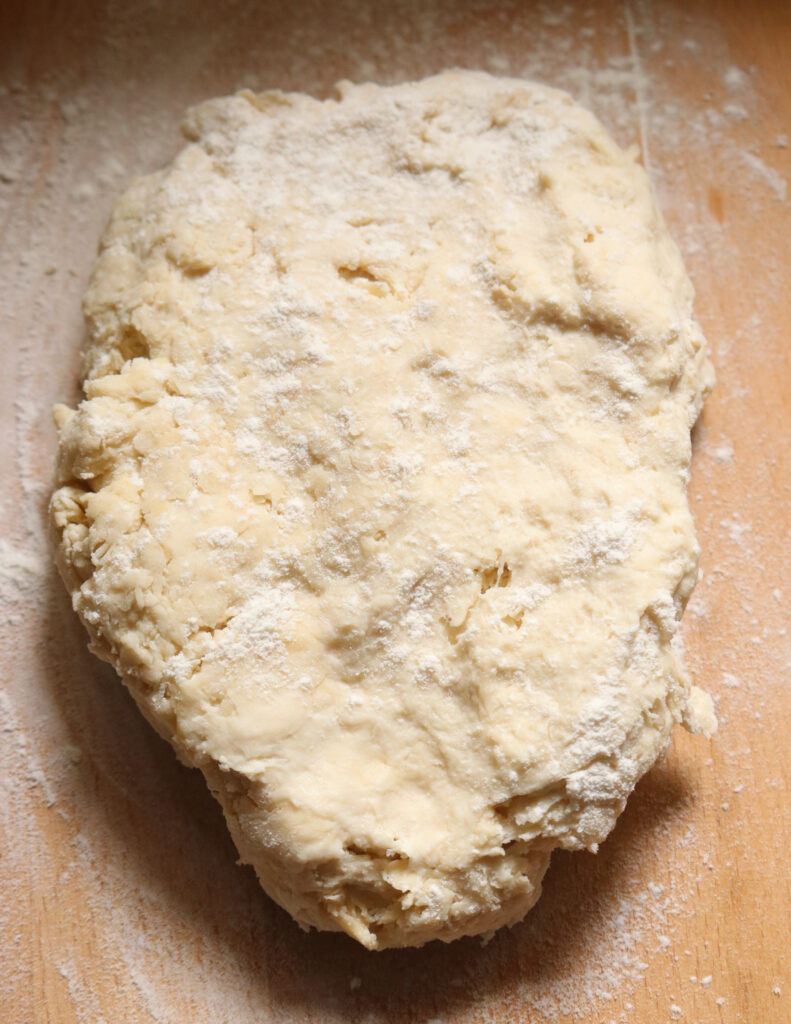 dough mixed and ready on a floured board to make kibula banis.