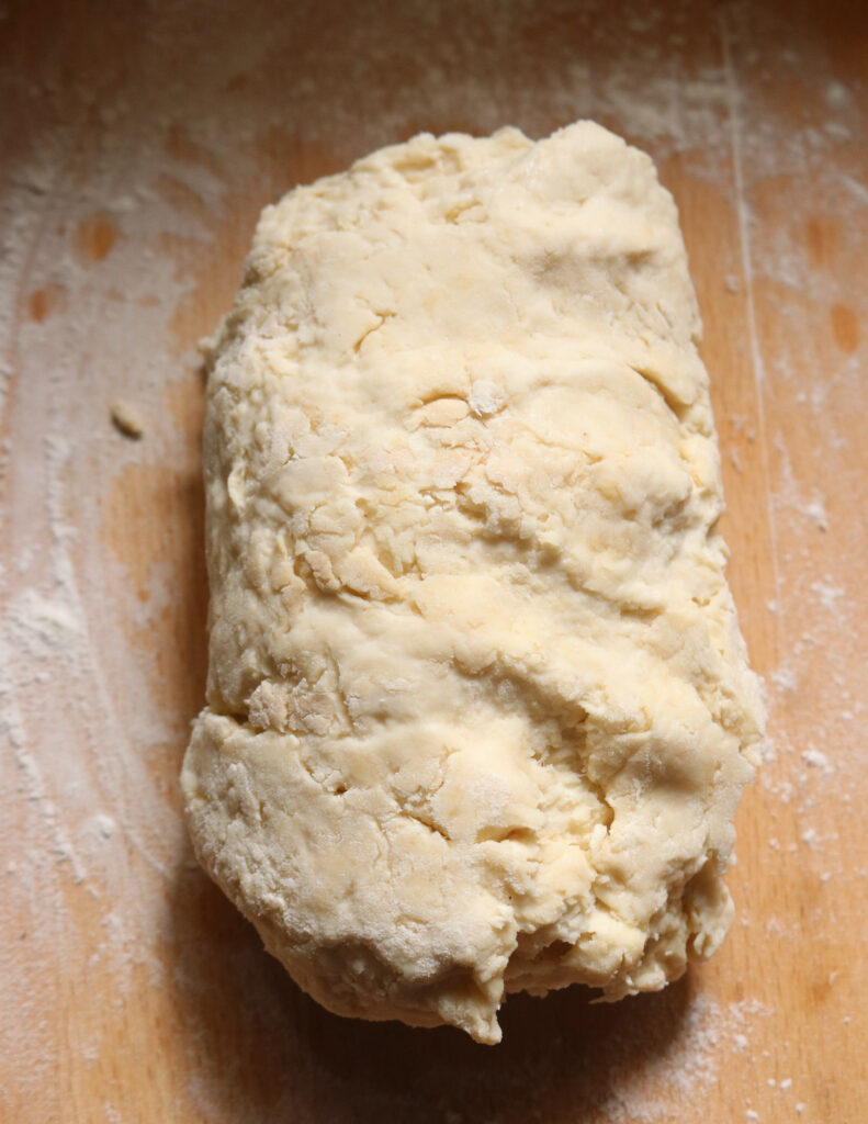 kibula banis dough placed on a board.