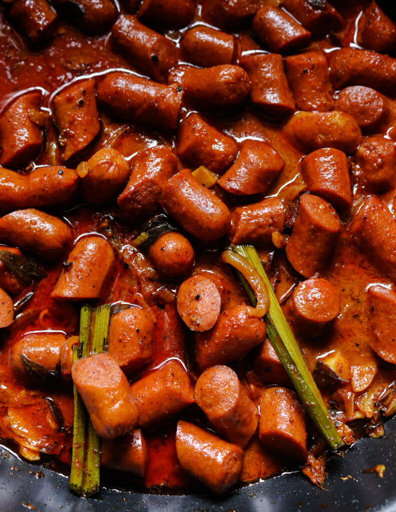 curried sausage pieces cooked in a thick spicy gravy made out of coconut milk.