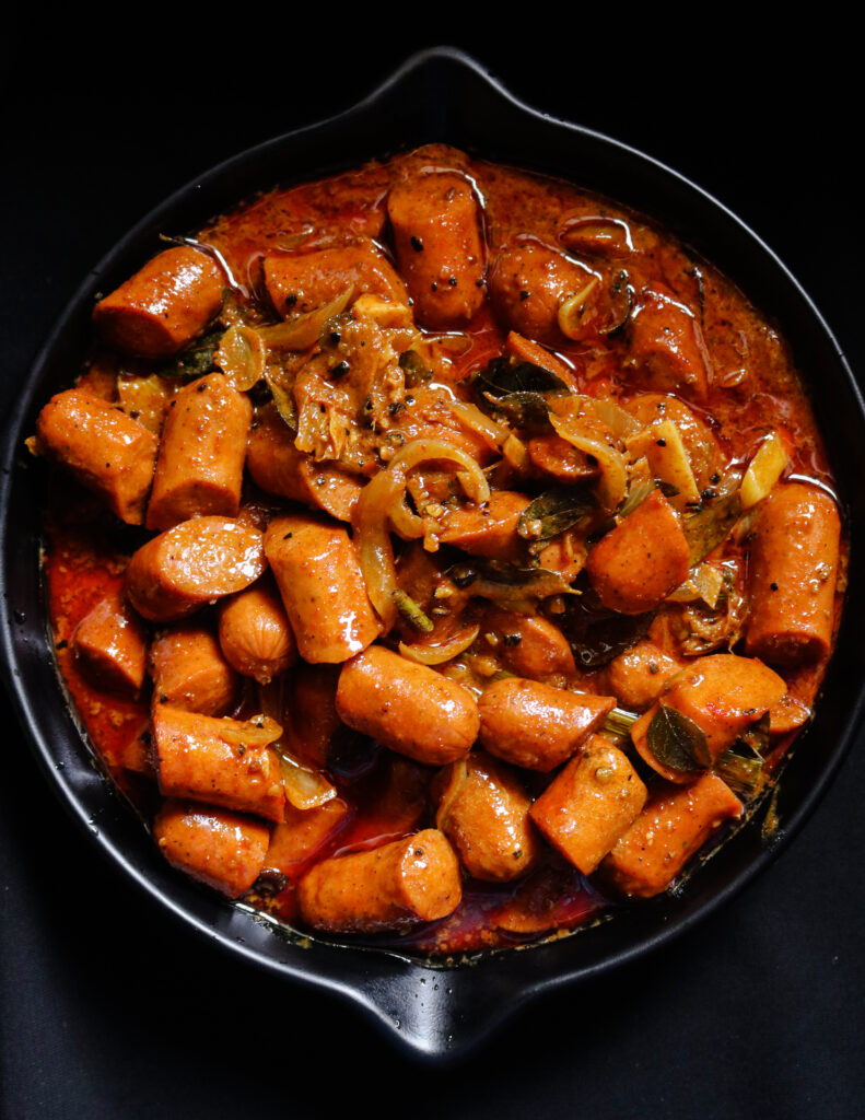 curried sausages in a coconut milk curry cooked in Sri lankan spices.