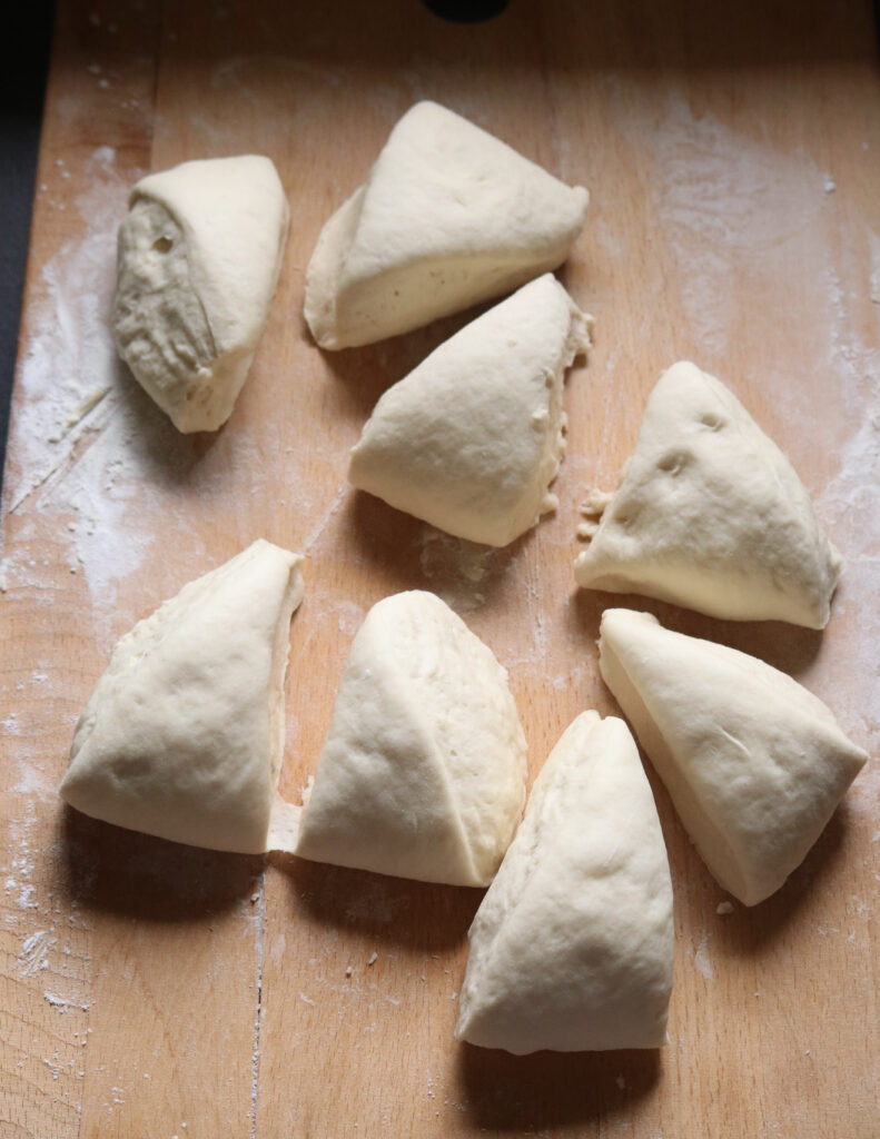 deviding the dough into more pieces to make the kibula banis