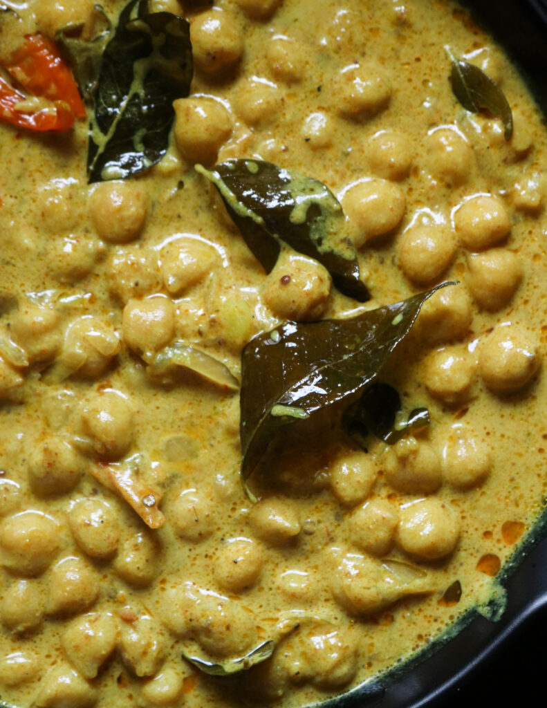 creamy coconut milk chickpea curry served in a black bowl