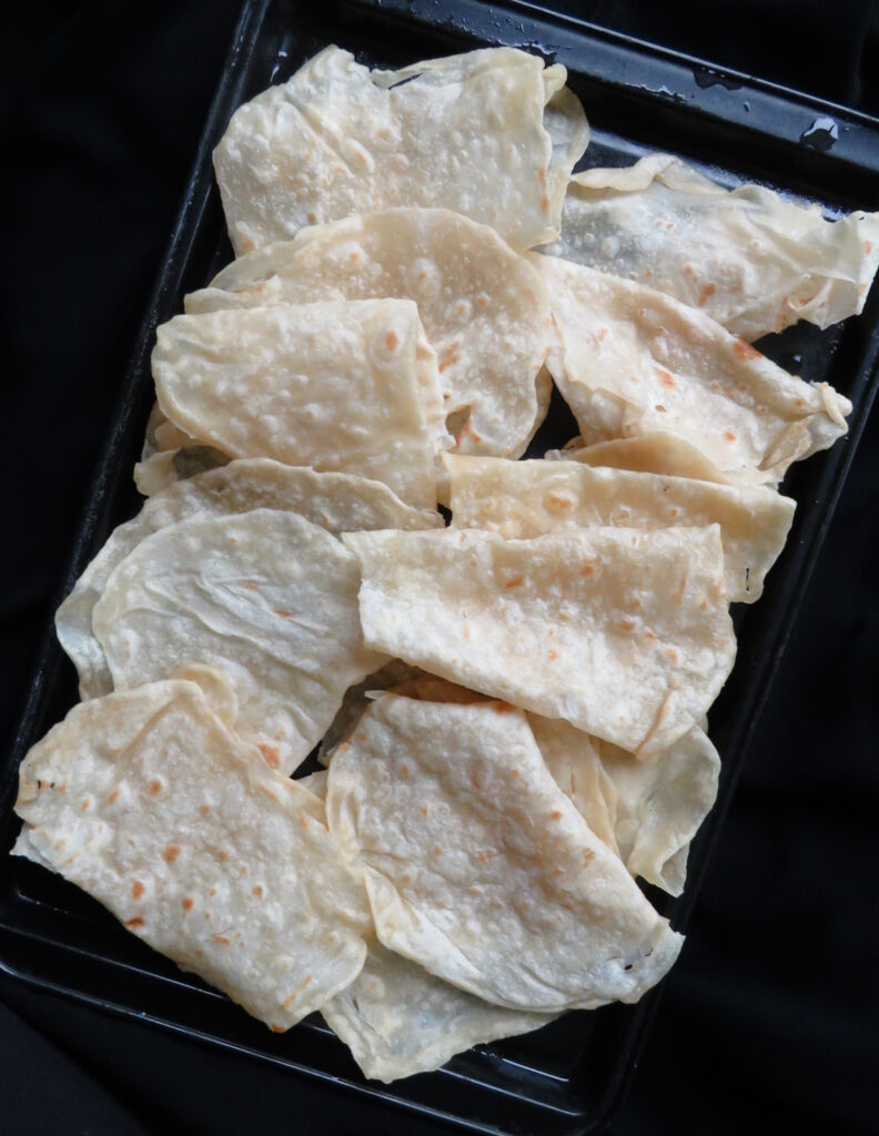 godamba roti placed on a black tray.