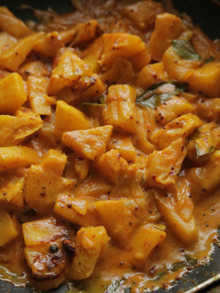 creamy pineapple curry on a cooking pan.