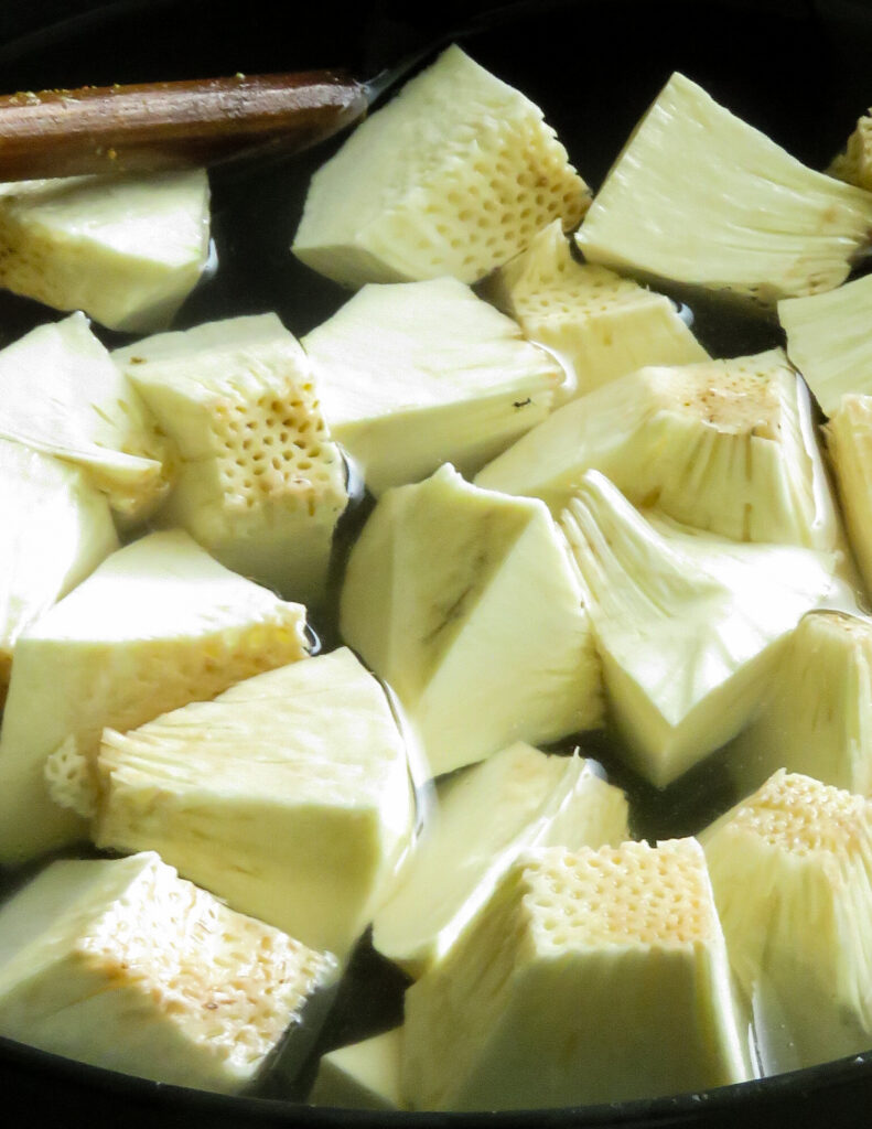 clean and cut bread fruit submerged in water.