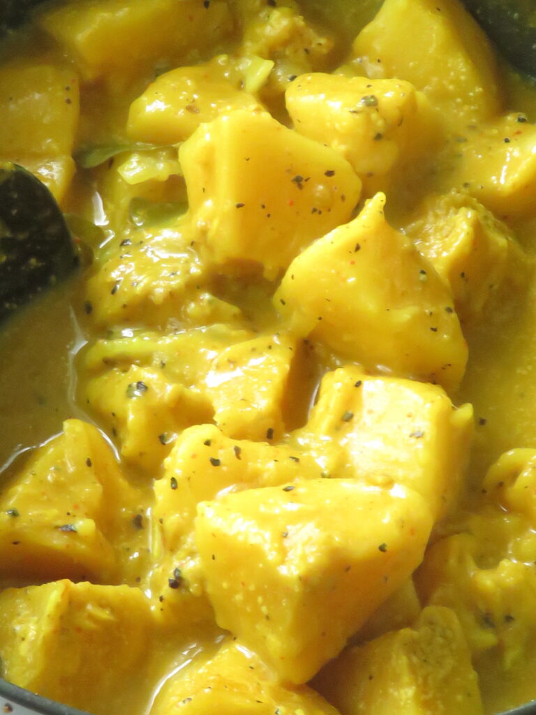 cooked bread fruit curry with coconut milk .