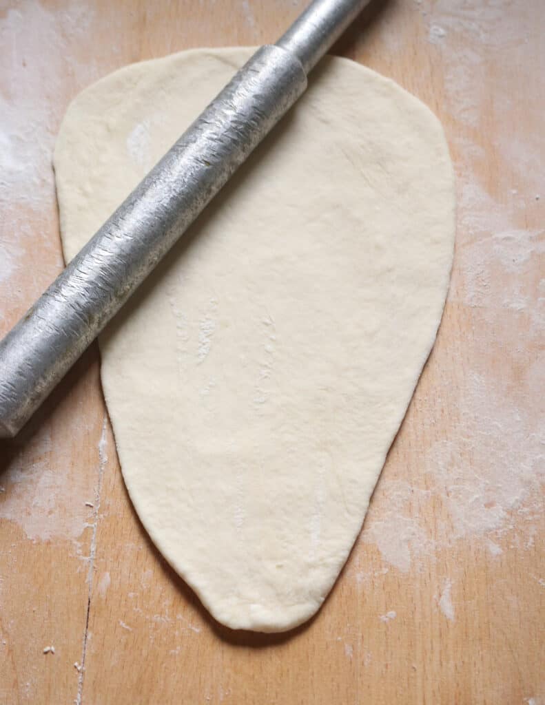 stretched dough with a rolling pin.