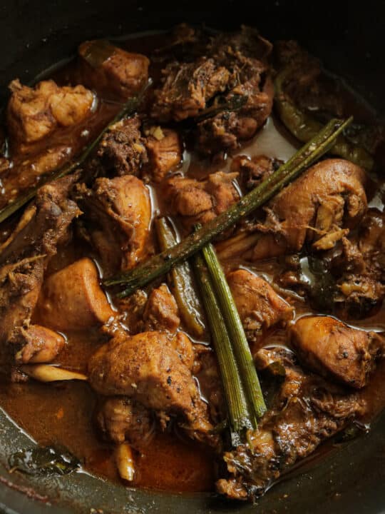 jaffna curry powder chicken curry cooked in a pot.