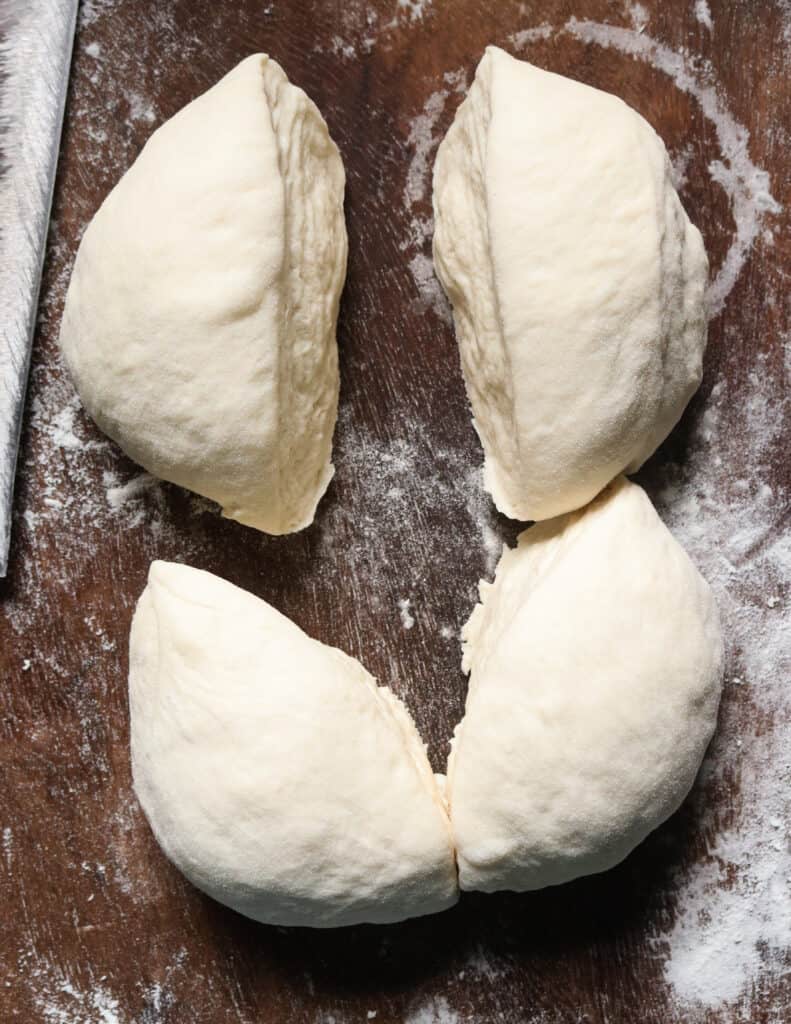 cutting the dough into equal part to make the roast bread.