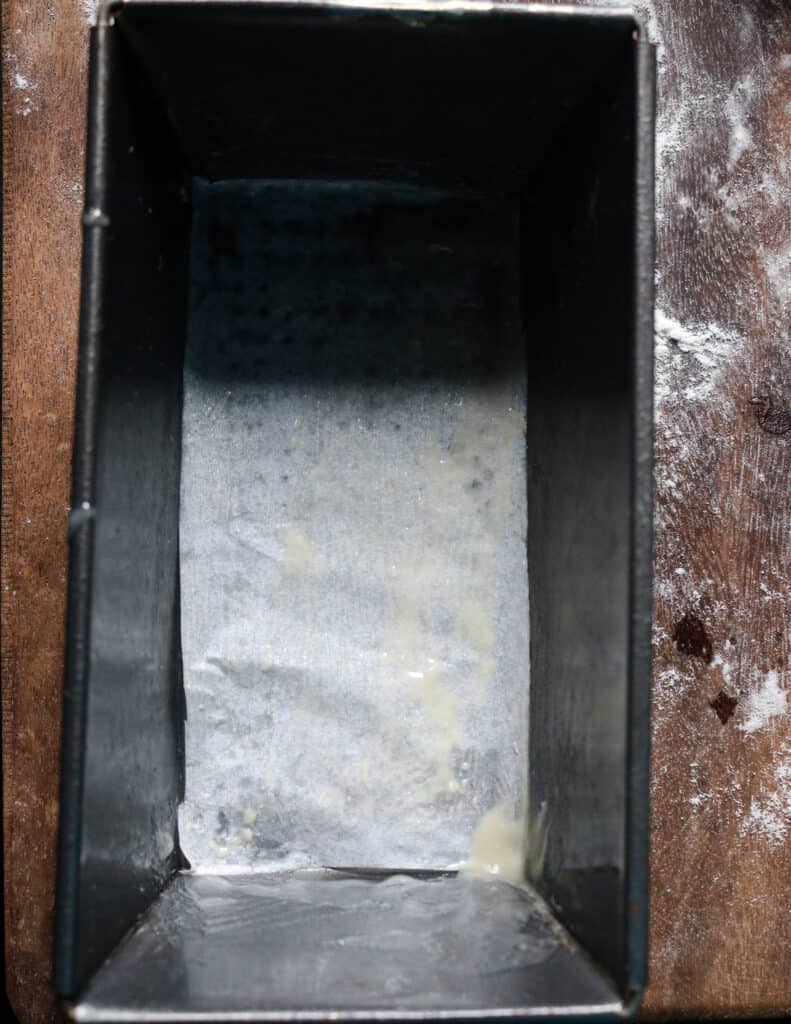 loaf pan covered with parchment to make the roast paan recipe.