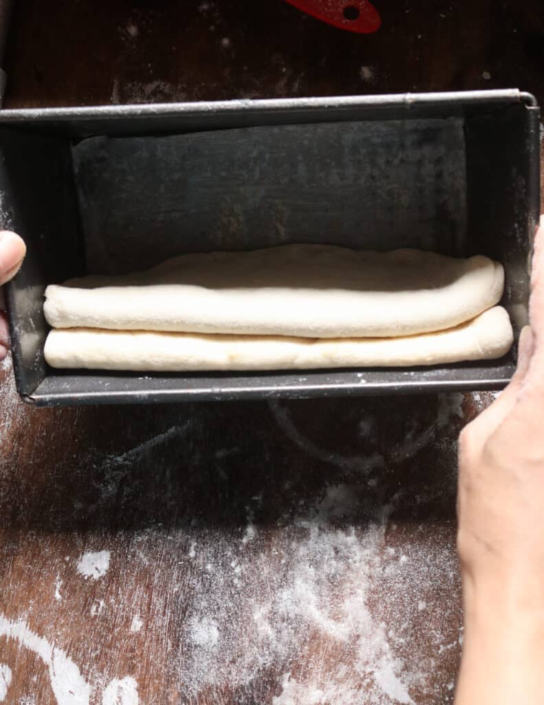 layering each shaped dough to make the roast paan