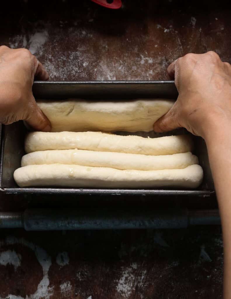 separating the shaped dough and adjusting the roast paan.