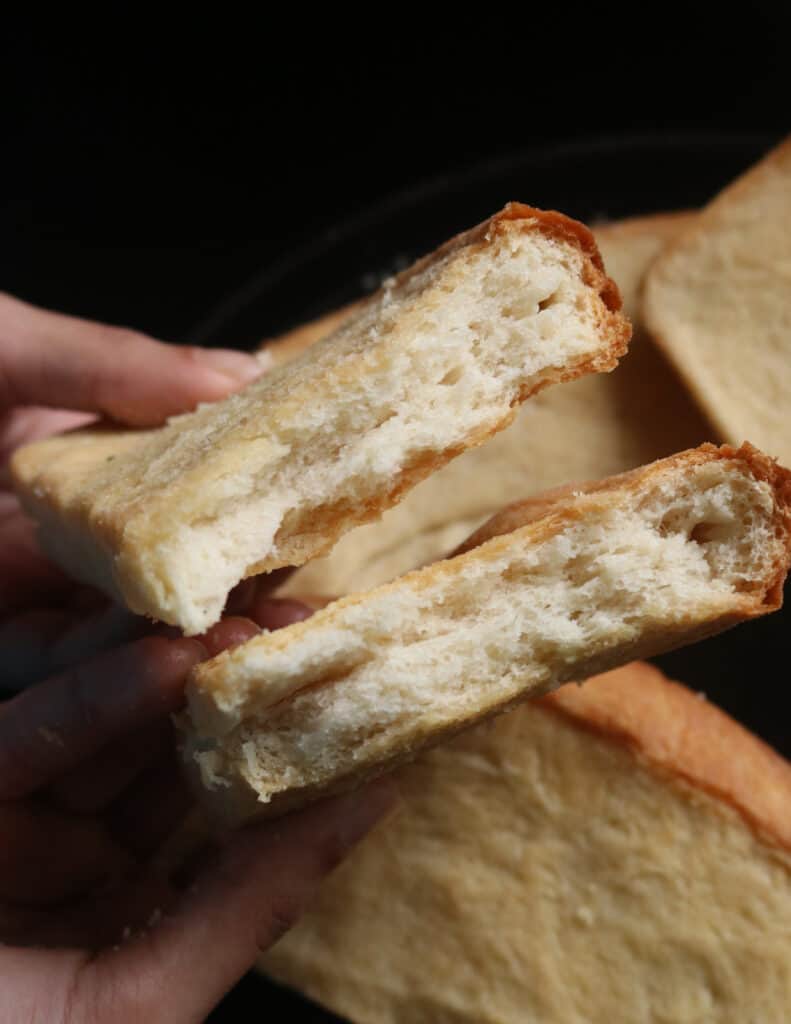 roast paan(bread)that has been torn into two.