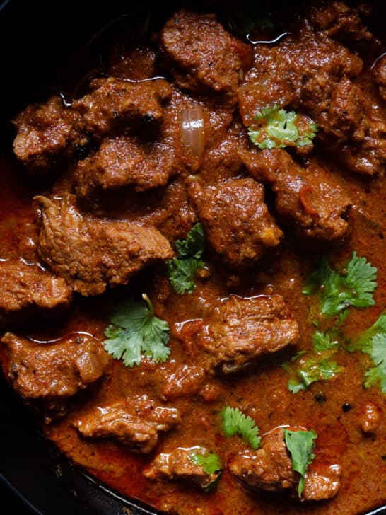 vindaloo beef curry served in a bowl.