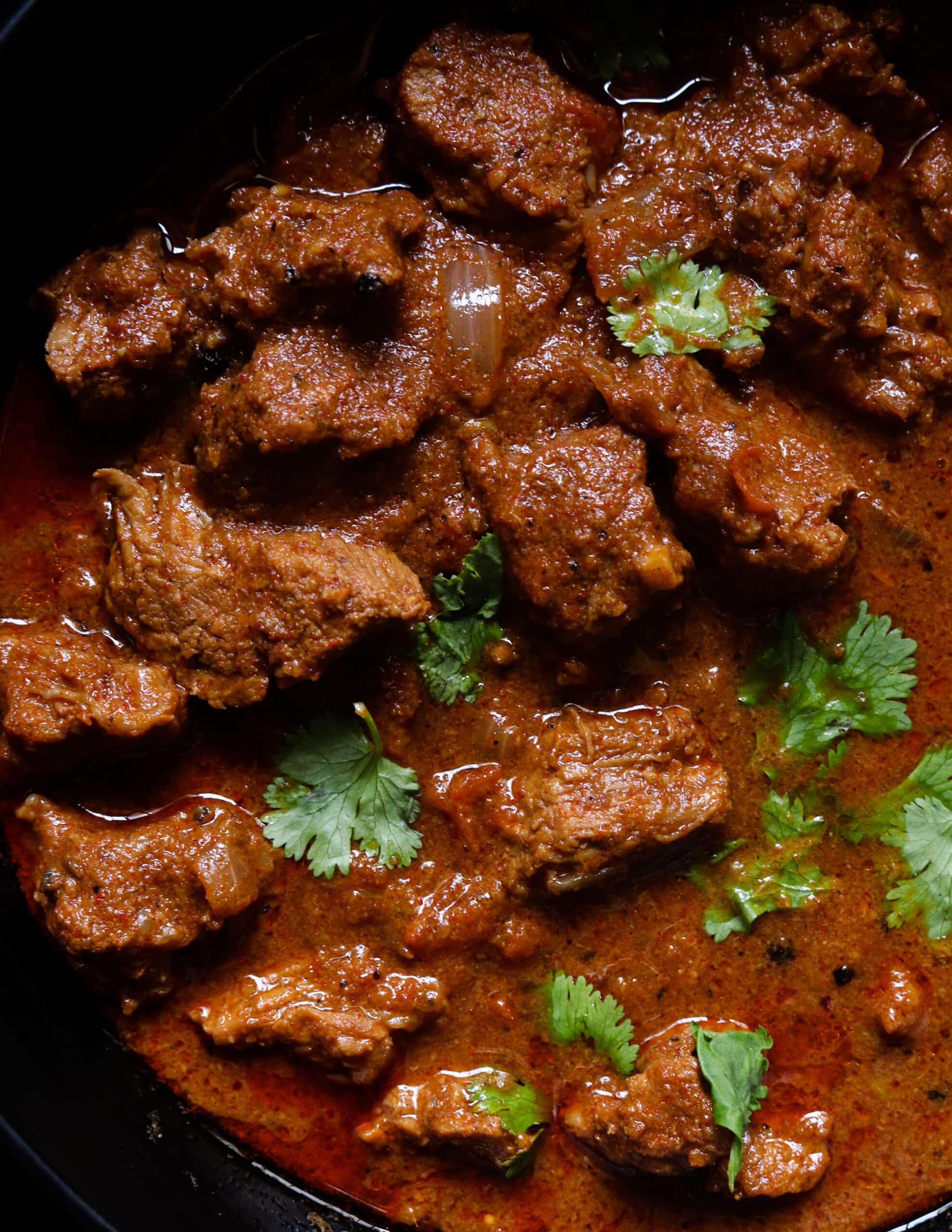 vindaloo beef curry served in a bowl.