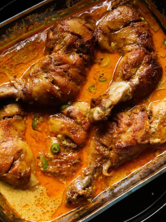 baked curry chicken served in a dish.