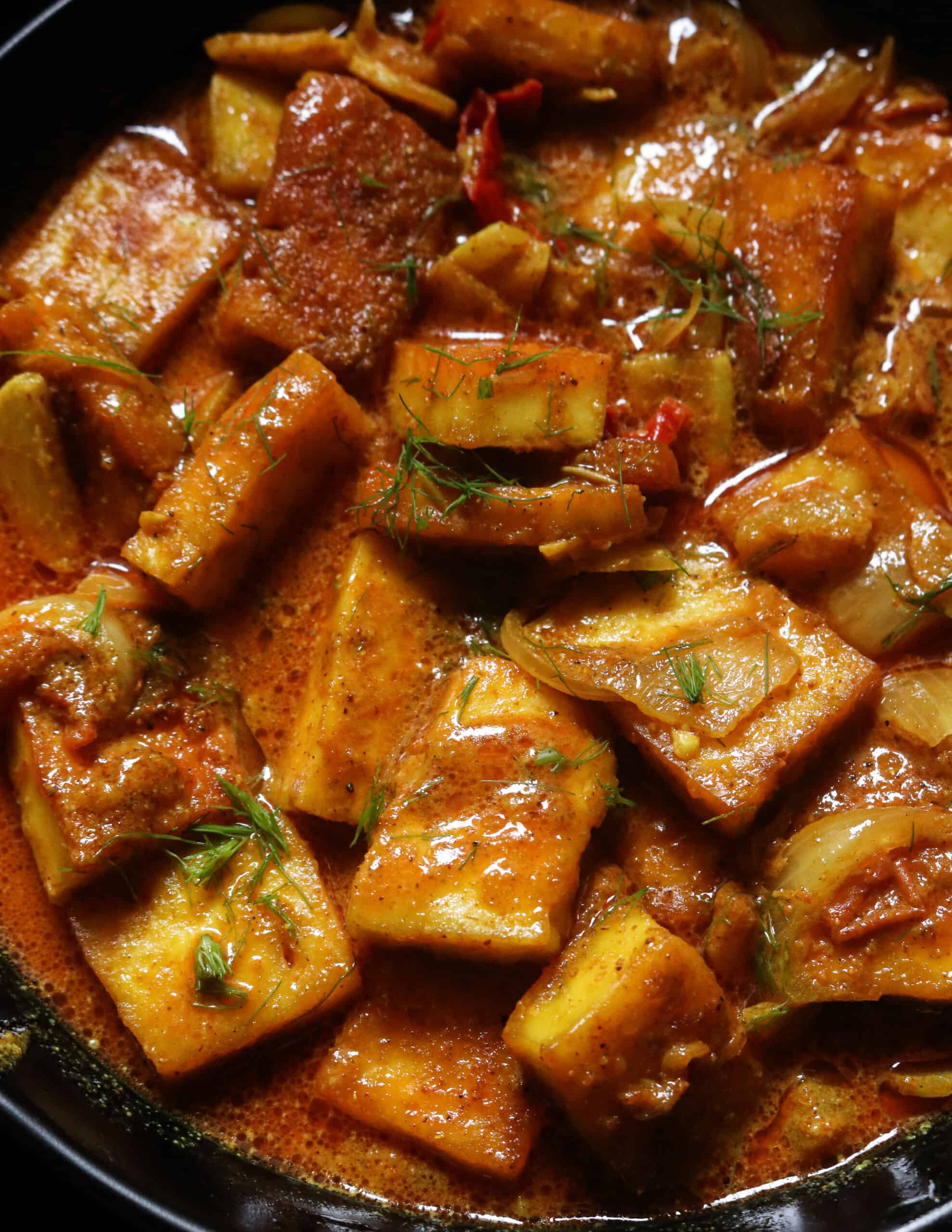 easy paneer curry cooked and served in a bowl.