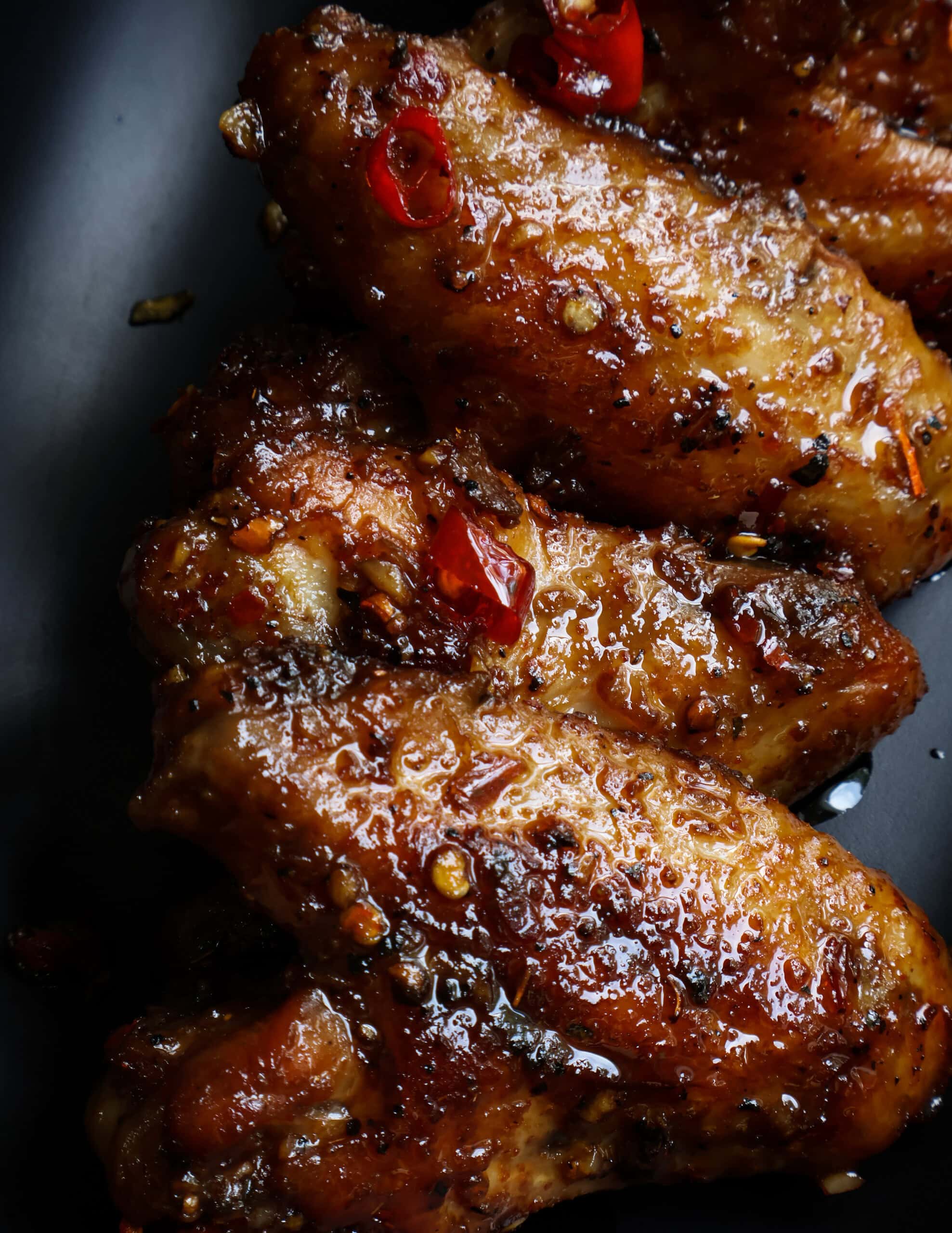 sweet and spicy chicken wings covered in chilli garlic oil.