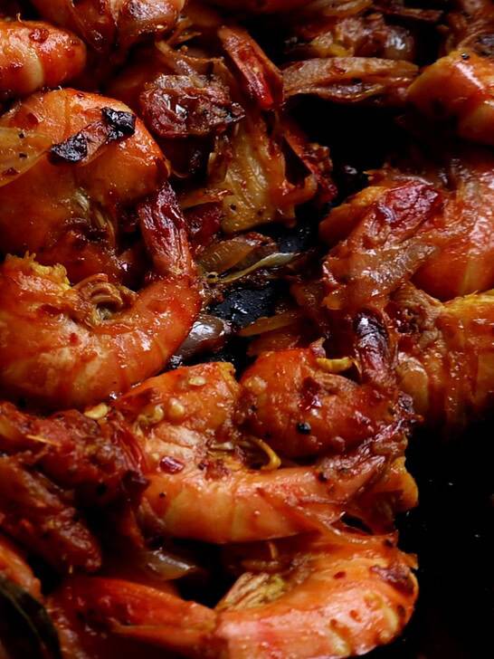 spicy prawn stir fry cooked over a stove top